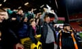 The Cray Valley Paper Mills manager, Steve McKimm, celebrates with a replica FA Cup after his side drew at Charlton this season to earn a replay.