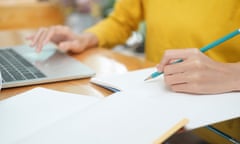 Close-up of woman using laptop.