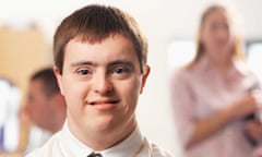 portrait of a man with Down's syndrome working in an office