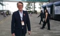 Peter Mandelson smiles as he is photographed walking outside wearing a lanyard at Labour’s annual conference in Liverpool