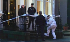 Police and forensic officers attend the scene of a shooting at the Regency Hotel in Dublin