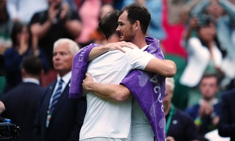 Andy Murray hugs his brother Jamie after their doubles match defeat to Rinky Hijikata and John Peers.