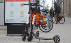 Bird dockless electric scooters next to a bike-sharing docking station in Washington DC