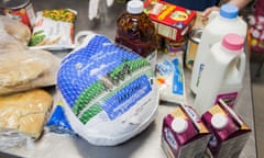 NEW YORK, NY - November 23rd, 2015:  Zoila Estrella, 74, a volunteer at the West Side Campaign Against Hunger, checks recipients out in the food pantry on Monday morning. 

CREDIT: Alex Welsh for The Guardian