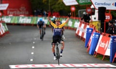 The defending champion Primoz Roglic celebrates after winning stage one of the Vuelta a España.