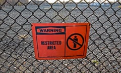 a sign reads "warning restricted area"