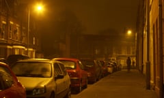 man following another man under streetlights on narrow dark nighttime street in Belfast<br>AT2PDR man following another man under streetlights on narrow dark nighttime street in Belfast