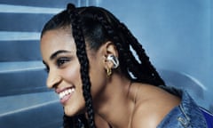 A model poses wearing the Bose Ultra Open earbuds.