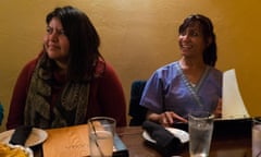 Yolanda Begay, 31 (left), and Agnes Terza, 48, react during a conversation about the presidential election on 16 May 2016 in Denver, Colorado. Photograph: Bastien Inzaurralde for the Guardian