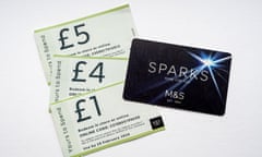 a picture of the black M&S Sparks car and vouchers