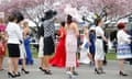 Women queue up displaying the glamour of Ladies’ Day.