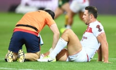 England’s Sam Burgess is treated on the pitch during his side’s Rugby League World Cup defeat to Australia in Melbourne.