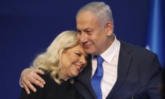 Israeli Prime Minister Benjamin Netanyahu hugs his wife Sara after first exit poll results for the Israeli elections at his party’s headquarters in Tel Aviv, Israel, Monday, March. 2, 2020