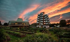 The futuristic looking hotel, with a dramatic sunset.