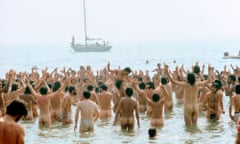 Stripping off on the beach during the Isle of Wight music festival, 1969.