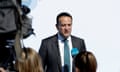 Leo Varadkar speaking into a microphone in front of a white backdrop