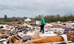 A woman sifts through the remains of houses destroyed by a string of tornadoes in Ohatchee, Alabama, last week.