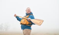 Stuart Foulstone holding a paddle, near his home in Wiltshire