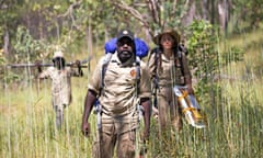 Warddeken Indigenous protected area ranger Garrett Pamkal leads ecologist Cara Penton and fellow ranger Frankie Nadjamerrek to a remote site in Arnhem Land