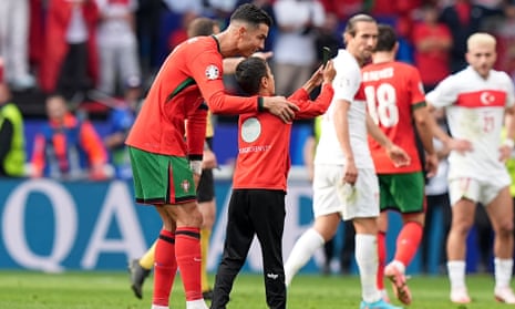 Young pitch invader takes selfie with Ronaldo during Portugal game – video 