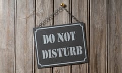 Do Not Disturb Sign Hanging on Wooden Wall