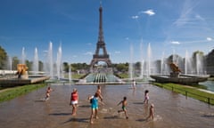 Splashing in fountains in Paris’s Trocadero Gardens, across the river from the Eiffel Tower.