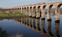 East coast mainline train passing over viaduct.