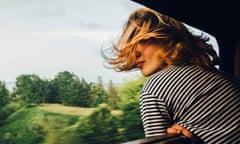 Woman looking at the view from train