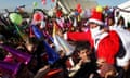 A Syrian-Kurdish refugee man dressed in Santa Claus takes part in Christmas celebrations at the Quru Gusik (Kawergosk) refugee camp