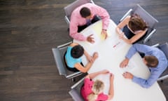 Five businesspeople at boardroom table