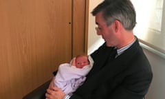 Tory MP Jacob Rees-Mogg with child.