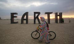 A participant walks past an art installation as approximately 70,000 people from all over the world gather for the 30th annual Burning Man arts and music festival in the Black Rock Desert of Nevada, U.S. August 30, 2016. REUTERS/Jim Urquhart FOR USE WITH BURNING MAN RELATED REPORTING ONLY. FOR EDITORIAL USE ONLY. NOT FOR SALE FOR MARKETING OR ADVERTISING CAMPAIGNS. NO THIRD PARTY SALES. NOT FOR USE BY REUTERS THIRD PARTY DISTRIBUTORS