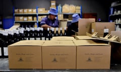 South African Wineries Bring In The Harvest. WELLINGTON, SOUTH AFRICA - FEBRUARY 20: Winery workers pack wines into boxes bearing the motto "Faith, Hope and Love" at the Bosman Family Vineyards on the Lelienfontein estate on February 20, 2020 near Wellington in the Western Cape province of South Africa. Bosman Family Vineyards are one of many South African wineries committed to sustainability and Fairtrade, with many of the estate's 5th generation workers receiving 26% ownership of the business through the biggest Black Economic Empowerment deal in the wine industry between the Bosman family and the laborers' Adama Workers Trust. (Photo by David Silverman/Getty Images)
