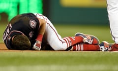 Washington Nationals’ Adam Eaton lies on the field after he was injured on a play at first base during the game against the New York Mets last month.