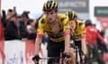 Primoz Roglic crosses the finish line in front of Jumbo-Visma teammate Jonas Vingegaard