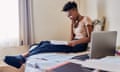 Shot of an female university student reading a textbook in her room