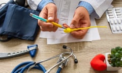 Doctor during consultation held in his hand and shows patient anatomical model of male sperm. Counseling of men and couples about male infertility, sperm pathology, impossibility to get pregnant