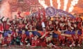 Liverpool v Chelsea<br>The Liverpool players and management in front of the Kop after collecting the Premier League trophy following the Liverpool v Chelsea Premier League match at Anfield on July 22nd 2020 in Liverpool (Photo by Tom Jenkins/ NMC Pool)