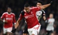 Murillo of Nottingham Forest holds off Raúl Jiménez of Fulham