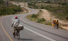 Traffic moves along the newly rehabilitated Tanga ? Horohoro trunk road in Northeastern Tanzania.<br>FA6E59 Traffic moves along the newly rehabilitated Tanga  to Kenya - Tanzania border traffic  at Horo Horo trunk road, Northeastern Tanzania, 30 October 2012