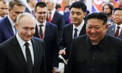 The Russian president, Vladimir Putin (left), and North Korea's leader, Kim Jong-un, smile after talks in Pyongyang