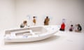 members of the public drawing on the walls and on a lifesize white boat in Add Colour (Refugee Boat), 2016 by Yoko Ono.