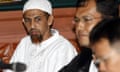 Umar Patek sits with his lawyer during his trial in Jakarta in 2012. 