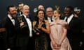 The cast and crew of Veep pose backstage with their award for outstanding comedy series.