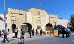 Security members stand guard outside the court in Amman where the two men were sentenced.