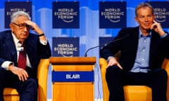 Tony Blair and Henry Kissinger on stage