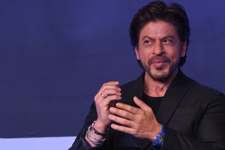Close-up of Shah Rukh Khan smiling and gesturing.