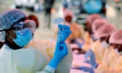 FILE PHOTO: A health worker fills a syringe with Ebola vaccine before injecting it to a patient, in Goma, Democratic Republic of Congo, August 5, 2019. REUTERS/Baz Ratner/File Photo