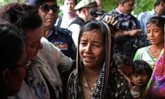 British United Nations Ambassador Karen Pierce consoles a twelve-year-old Rohingya refugee near Cox’s Bazar, in Bangladesh, April 29, 2018. REUTERS/Michelle Nichols