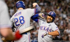 The Rangers' Marcus Semien, right, celebrates his three-run home run with Jonah Heim during the third inning of Tuesday’s Game 4 of the World Series at Chase Field.